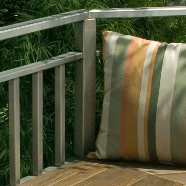 custom metalwork railing deck balcony seating area with striped pillow