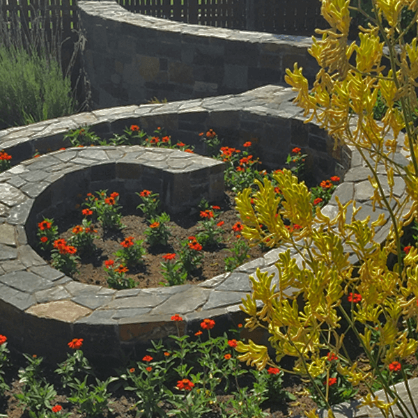 spiral stone wall planting bed