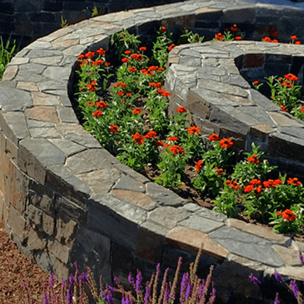 spiral stone wall planting bed curved
