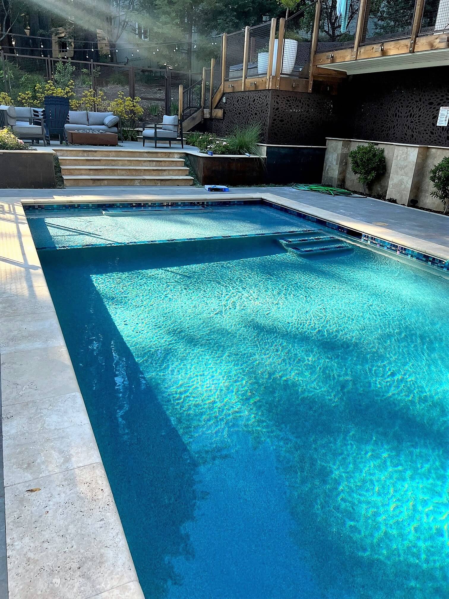 Swimming pool built on a slope in a California bakyard