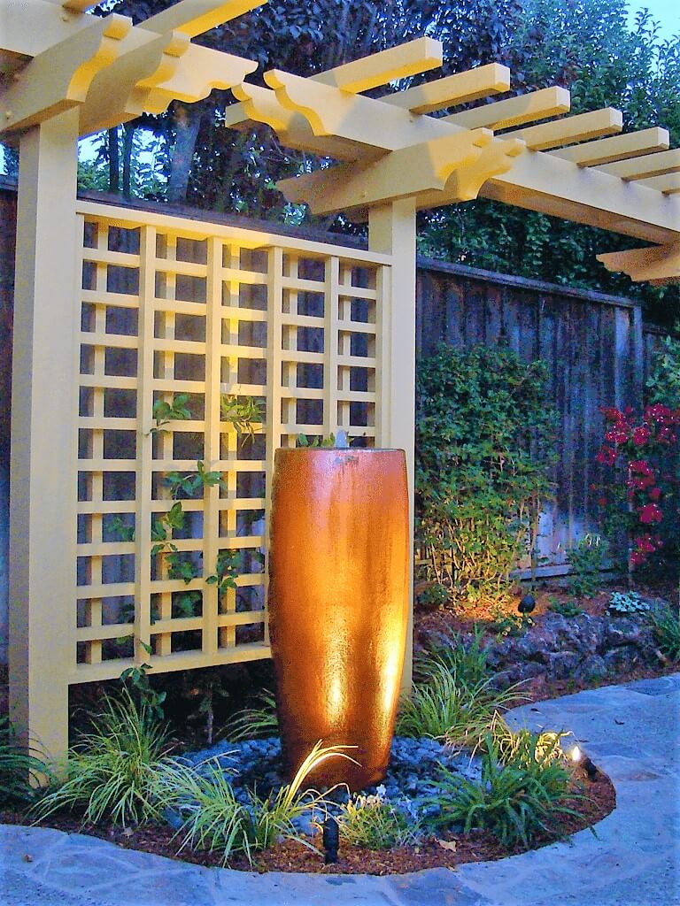 Custom wood pergola with copper concrete fountain feature