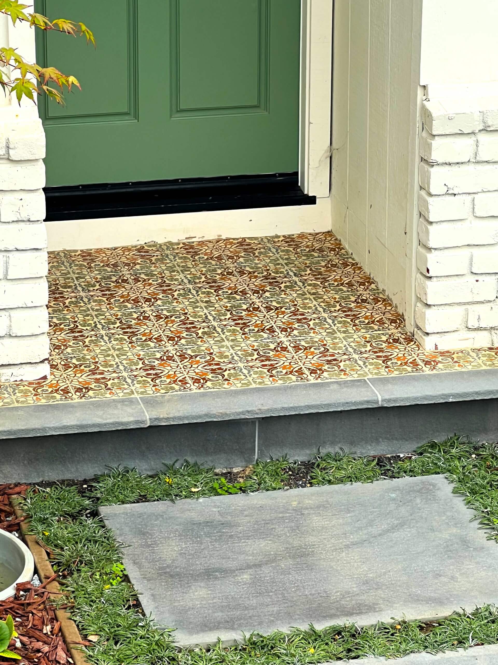 Mediterranean tile covering small front stoop of Altos CA home