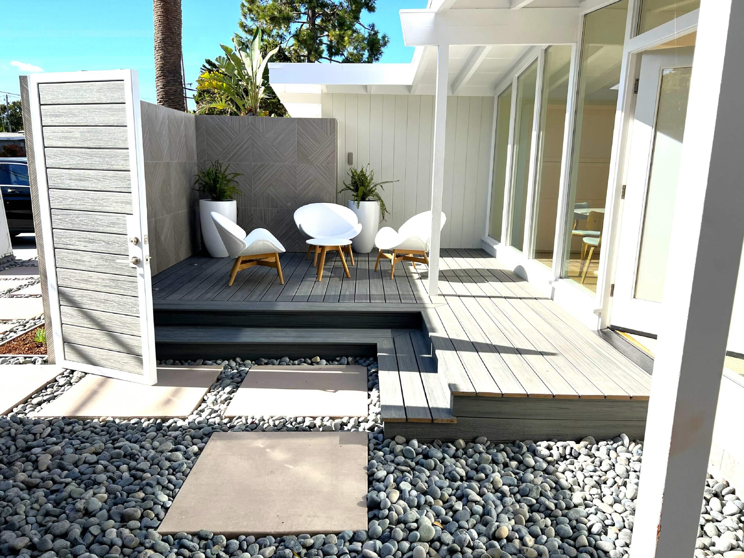 Eichler home landscape remodel with front entrance exterior deck within courtyard