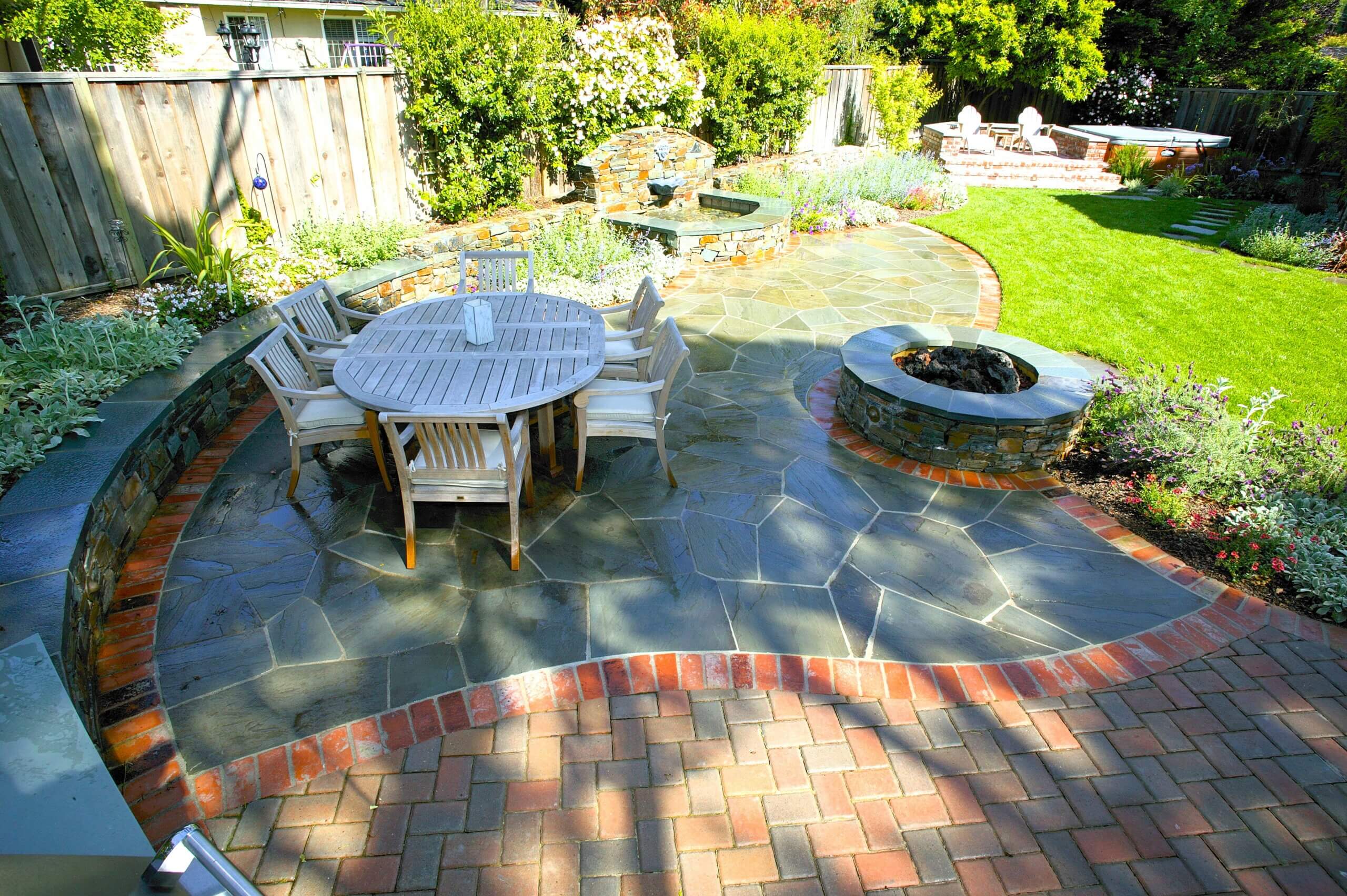 Decorative curved patio made from stone and brick